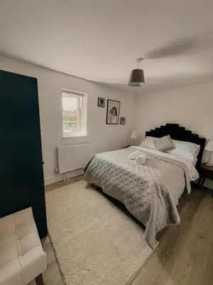 a bedroom with a large bed and a window at Modern Stay - Walk to Everything 4 in Ipswich