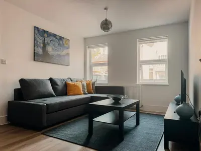 a living room with a couch and a table at Modern Stay - Walk to Everything 2 in Ipswich