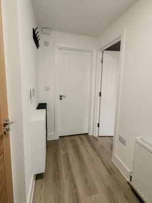 an empty room with white walls and wooden floors at Modern Stay - Walk to Everything 2 in Ipswich