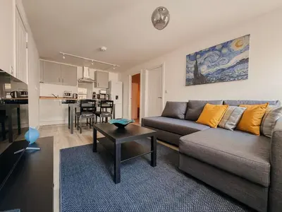 a living room with a couch and a table at Modern Stay - Walk to Everything 2 in Ipswich