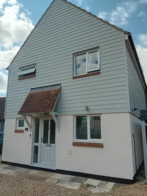 a white house with a brown roof at 'Ks' Yard in Great Dunmow
