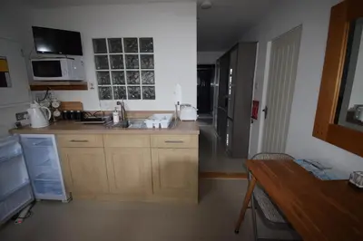 a kitchen with a sink and a counter top at Eco Deco in Frinton-on-Sea