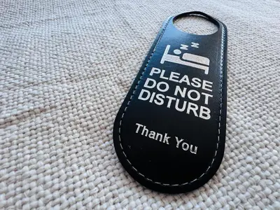 a remote control sitting on top of a blanket at Pacific Hotel in Clacton-on-Sea