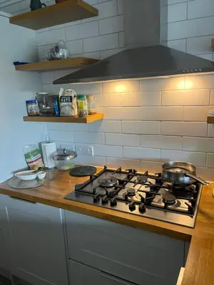 a kitchen stove top with pots and pans on it at Valley View in Sudbury