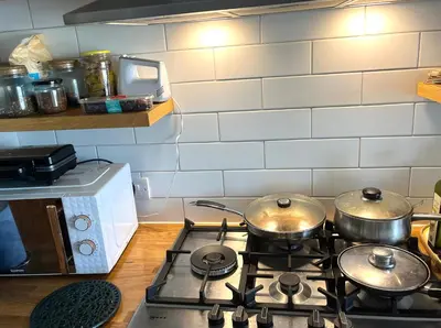 a stove with pots and pans on top of it in a kitchen at Valley View in Sudbury