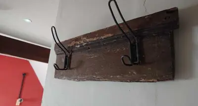 an old metal object hanging on a wall at Alma Inn & Dining Rooms in Harwich