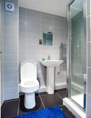 a bathroom with a toilet and a sink and a shower at Cozy 2BR 2BATH Apt in Central Ipswich - Sleeps 6 & Prime Location in Ipswich