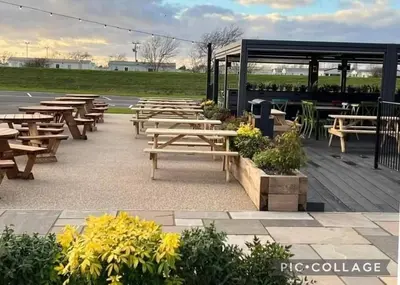 a group of picnic tables in a parking lot at Seaside caravan in Clacton-on-Sea