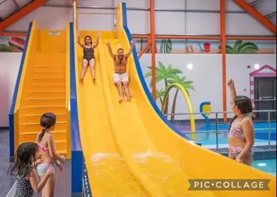 a group of children playing on a slide in a pool at Seaside caravan in Clacton-on-Sea