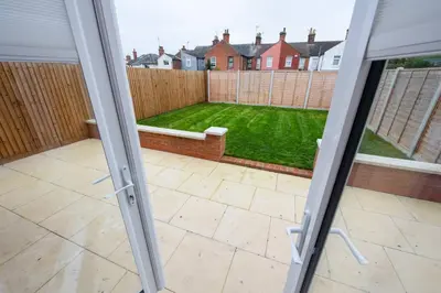 a view of a garden from the outside of a patio door at 3 Bed 2.5 Bath Detached House,Parking,Pet Friendly in Parkeston