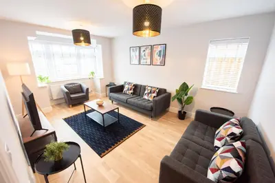 a living room with a couch and a tv at 3 Bed 2.5 Bath Detached House,Parking,Pet Friendly in Parkeston