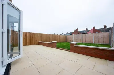 a patio with a glass door and a fence at 3 Bed 2.5 Bath Detached House,Parking,Pet Friendly in Parkeston