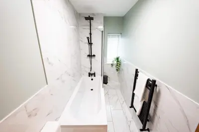 a white bathroom with a shower and a sink at 7 The Royal Serviced Apartments Harwich, Fair WiFi, Private Parking in Parkeston