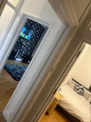 a room with a ceiling with a window and a bed at The Retreat On Retreat Road in Southend-on-Sea