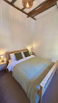 a bedroom with a large bed in a room at One Threadneedle Street, Dedham in Dedham