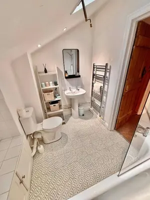 a bathroom with a toilet and a sink at One Threadneedle Street, Dedham in Dedham