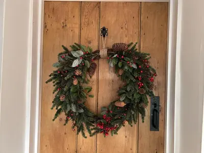 a christmas wreath on a wooden door at 1 Bed in Snape oc-a30669 in Snape