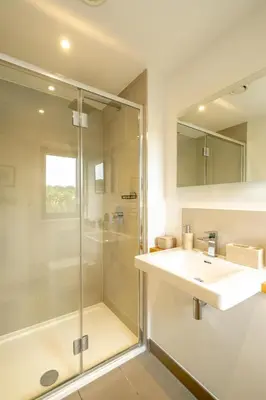 a bathroom with a sink and a shower at Sedge House, Eastbridge, Close to the coast, RSPB Nature Reserve, Dunwich, Sizewell and Leiston - Managed by Aldeburgh Coastal Cottages in Theberton