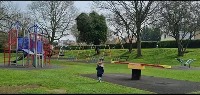 a young child walking in a park at Stylish 3 Bed Seaside Apartment Central Southend Location & Steps from the Beach in Southend-on-Sea