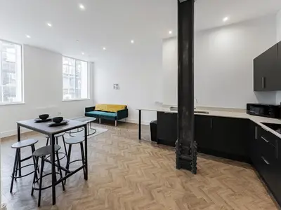 a kitchen with a table and chairs in a room at Stylish 1B Apt in Essex w Modern Touch in Chelmsford