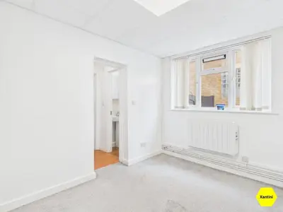 an empty room with a window and a radiator at New Spacious apartment in Milton