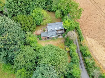 an aerial view of a house in the middle of trees at Finest Retreats - Hollybush Studio in Knebworth