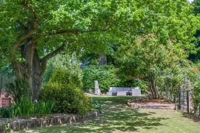 a park with trees and bushes and a cemetery at 2 Bed in Nayland oc-b32342 in Nayland