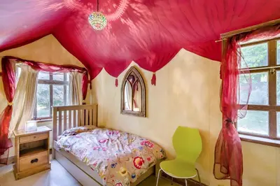 a bedroom with a bed with a pink ceiling at 2 Bed in Nayland oc-b32342 in Nayland