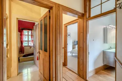a hallway with a door leading to a bedroom at 2 Bed in Nayland oc-b32342 in Nayland