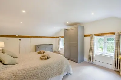 a bedroom with a bed with two towels on it at 4 Bed in Hartest oc-w32685 in Hartest