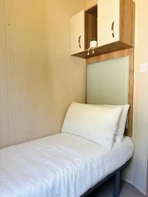a small bed in a small room at Cosy 2 bed in Dovercourt Holiday Park -Sleeps 6 in Harwich