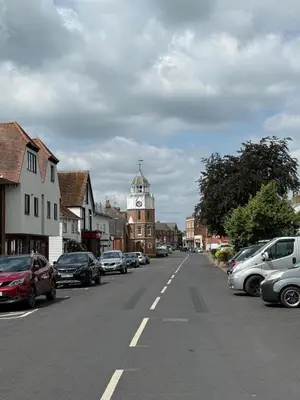 a town with a clock tower in the middle of a street at Rural Retreats 8 in Southminster