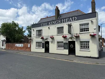 a white building with the kings head on a street at Rural Retreats 8 in Southminster