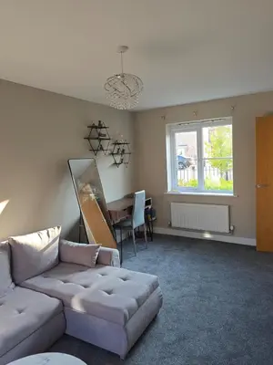 a living room with a couch and a table at Spacious & Homely Colchester Stay-Great Location in Hythe