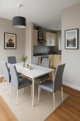 a kitchen with a dining room table and chairs at Spacious & Homely Colchester Stay-Great Location in Hythe