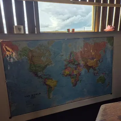 a map of the world on a window sill at The Cosy Hide - A romantic rural retreat for 2 in Cottenham