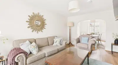 a living room with a couch and a table at Courtyards, 9 Mount street,Diss in Diss