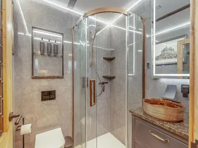 a bathroom with a shower and a sink at The School House Cottage in Bradwell on Sea