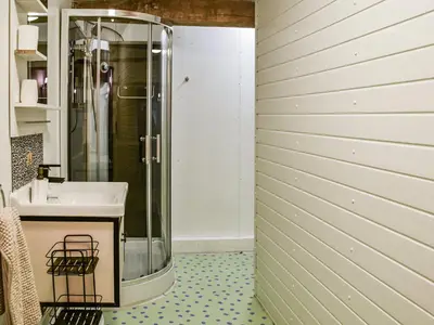 a bathroom with a sink and a shower at The Pool House - Uk48229 in Tibenham