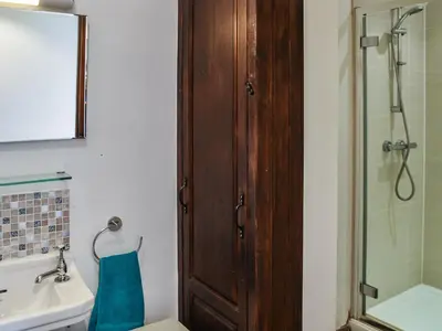 a bathroom with a shower and a toilet and a sink at The Retreat - Uk48231 in Tibenham