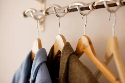 a bunch of clothes are hanging on a rack at The Packhorse Inn in Newmarket