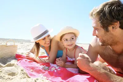 a group of people sitting on the beach at Great 8 Berth Caravan With Unlimited Wi-Fi At Seawick Holiday Park, Ref 27213Sw in Clacton-on-Sea