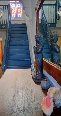 a staircase with a statue in the middle of a room at Number 5 in Harwich
