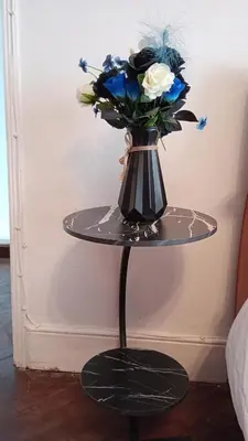 a vase with blue and white flowers on a table at Number 5 in Harwich