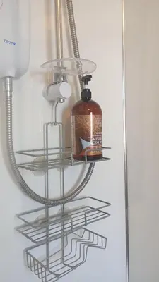 a glass shelf with a bottle inside of it at Number 5 in Harwich
