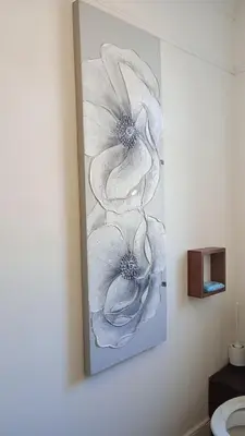 a painting of a white flower on a wall at Number 5 in Harwich