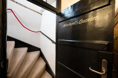 an open door to a room with stairs at Merchant Quarters, The Merchant House, Ipswich in Ipswich