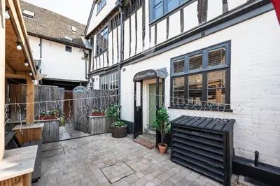 a courtyard of a house with a building at Silk Room, The Merchant House, Ipswich in Ipswich