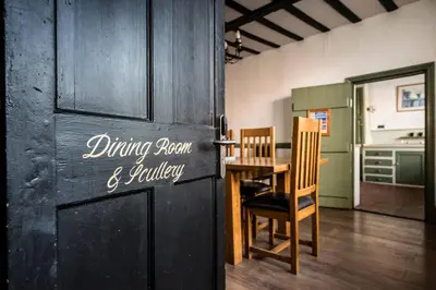 a kitchen with a dining room and a table and chairs at Wool Room, Merchant House, Ipswich in Ipswich