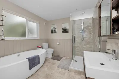 a bathroom with a tub and a shower and a toilet at Entire spacious house in BSE in Bury Saint Edmunds